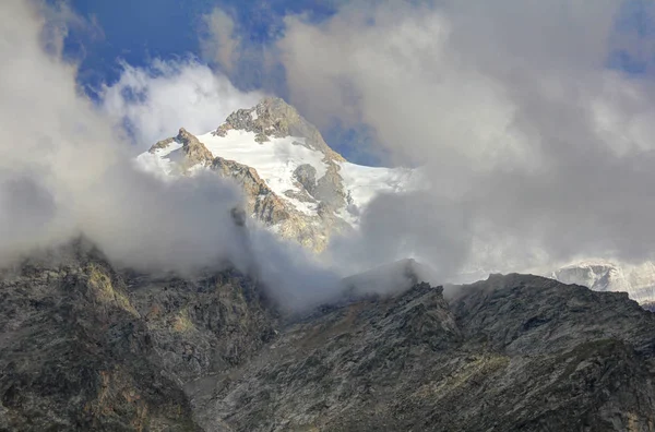 Peak Snow Capped Mountain Poking Clouds Caucasus Stock Photo