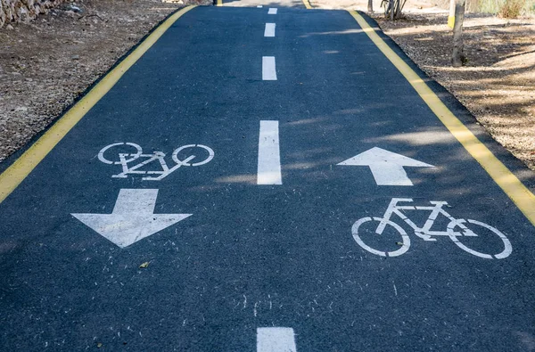 Bicycle sign on the road used for pedestrian crossing bicycle lane