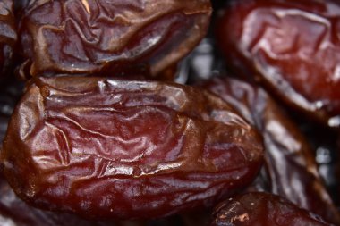 Date palm on a traditional craftsman market.Horizontal image. Dried fruits dates macro.