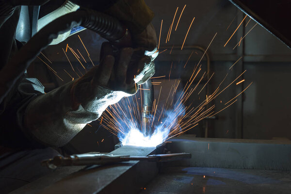 Industrial steel welder in factory welder, craftsman