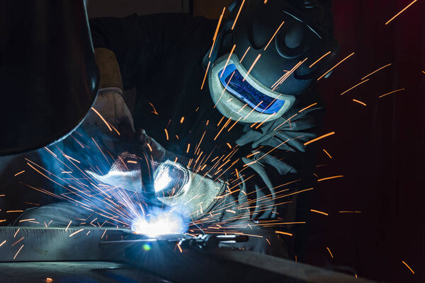 Industrial steel welder in factory welder, craftsman