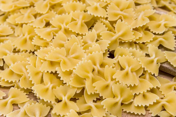 Some farfalle pasta forming a background pattern Stock Picture