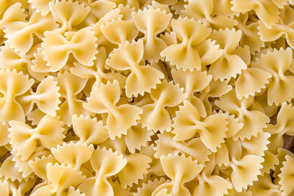 Some farfalle pasta forming a background pattern Stock Picture