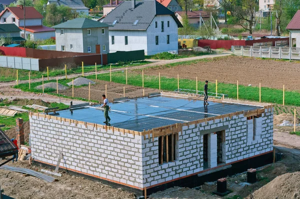 cement-filled foundation of a private house, the Foundation of the house under construction, fresh concrete foundation