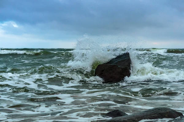 the waves beat against the rocks, the waves, the storm and stone