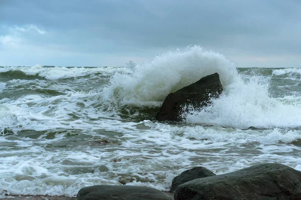 the waves beat against the rocks, the waves, the storm and stone