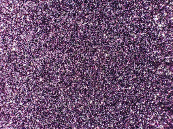 Background sequin. sequin BACKGROUND. glitter surfactant. Holiday abstract glitter background with blinking lights. Fabric sequins in bright colors. Fashion fabric glitter, sequins. Defocused.
