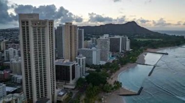 A sunrise drone hyperlapse filmed on the DJI Mavic 3 of Diamond Head Crater near Waikiki Beach in Honolulu, Hawaii.