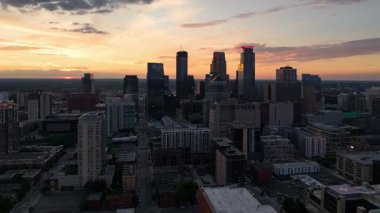 A hyperlapse of downtown Minneapolis by drone at sunset.
