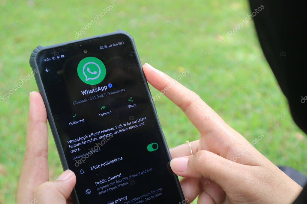 Madiun, Indonesia - September 7, 2025 : Official WhatsApp Channel displayed on an Android smartphone, held by a woman.
