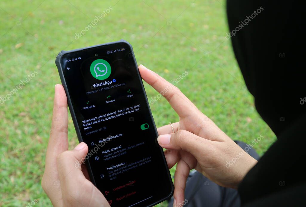 Madiun, Indonesia - September 7, 2025 : Official WhatsApp Channel displayed on an Android smartphone, held by a woman.