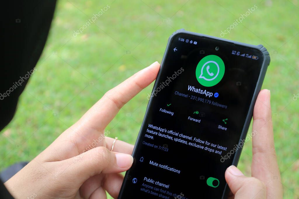 Madiun, Indonesia - September 7, 2025 : Official WhatsApp Channel displayed on an Android smartphone, held by a woman.