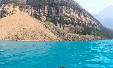 Turquoise Waters of Moraine Lake with Rocky Mountain Cliffs in Banff National Park