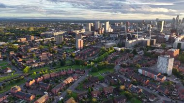 Enjoy stunning aerial perspectives of a bustling cityscape and serene residential areas during the golden hour. The warm light highlights the beauty of urban life and nature.