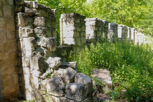 Cemetery wall. Ancient masonry.