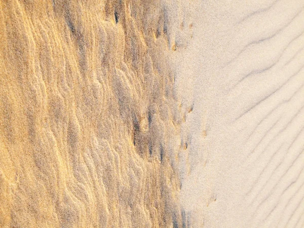 Beach Sand Background. Sand Texture. Brown sand. Background from fine sand. Sand background