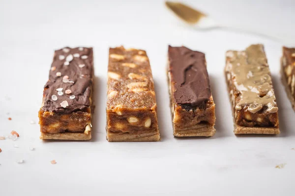 Vegan raw homemade nut chocolate candy bars. Healthy lifestyle and raw vegan food concept