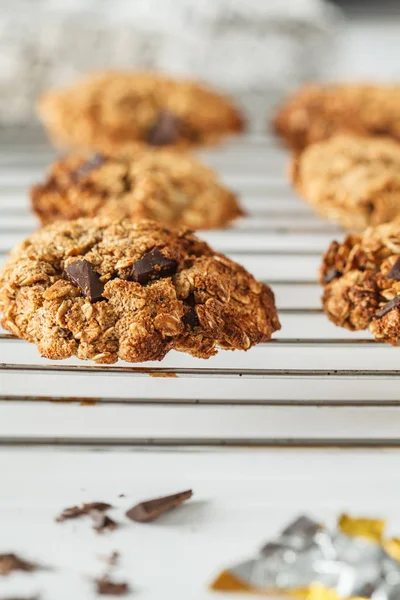 Vegan oatmeal cookies with chocolate on a light background. Food blog style concept.