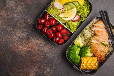 Healthy meal prep containers with grilled chicken with fruits, berries, rice and vegetables. Takeaway food jn dark background, top view clipart