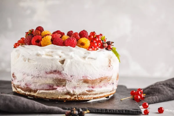Healthy vegan cake with coconut cream and berries. Healthy vegan food (dessert) concept.