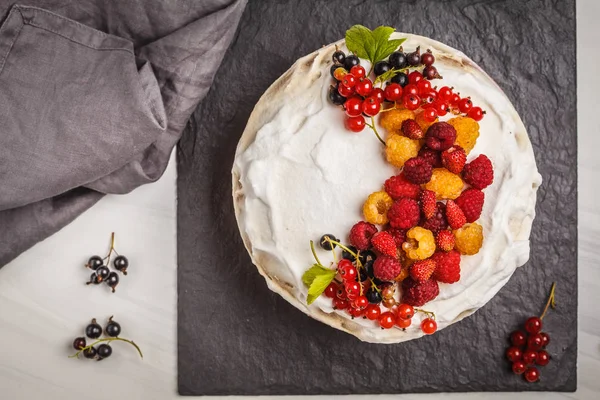 Healthy vegan cake with coconut cream and berries. Healthy vegan food (dessert) concept.