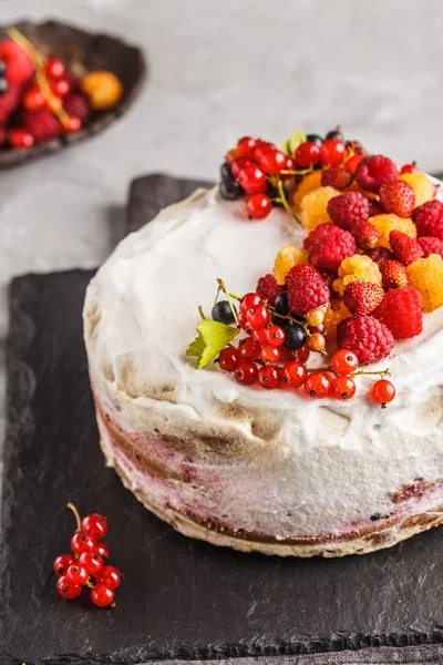 Healthy vegan cake with coconut cream and berries. Healthy vegan food (dessert) concept.