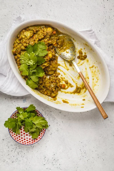 Lentil curry, Indian cuisine, tarka dal, white background. Vegan food. Clean eating concept.