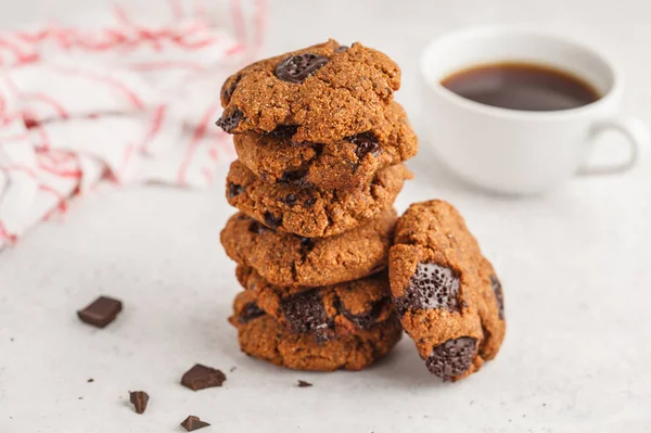 Stack of healthy vegan cookies with chocolate. Clean eating concept.
