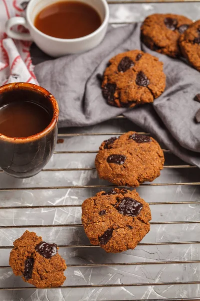 Healthy vegan cookies with chocolate, gray background. Clean eating concept.