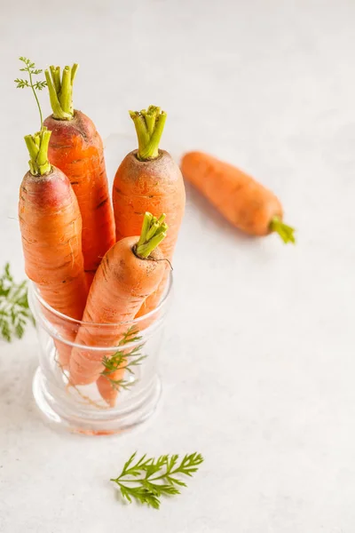 Raw carrots on a white background. Clean eating concept.