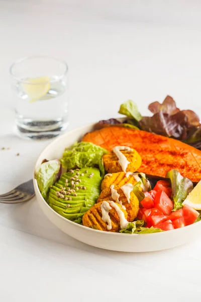 Vegan Rainbow bowl: meatballs vegetable, avocado, sweet potato and salad, copy space. Plant based diet concept.