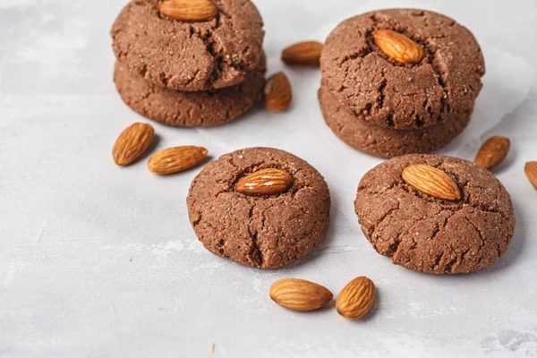 Almond cookies with cocoa on a white background. Vegan dessert concept.