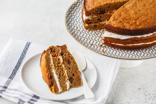 Vegan carrot cake with coconut cream. Healthy vegan food concept.