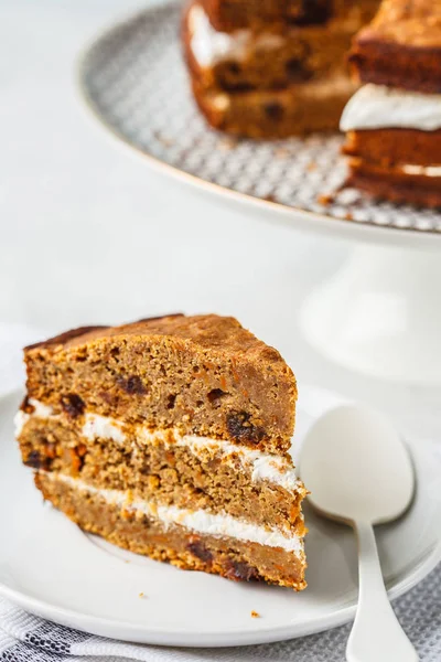 Vegan carrot cake with coconut cream. Healthy vegan food concept.