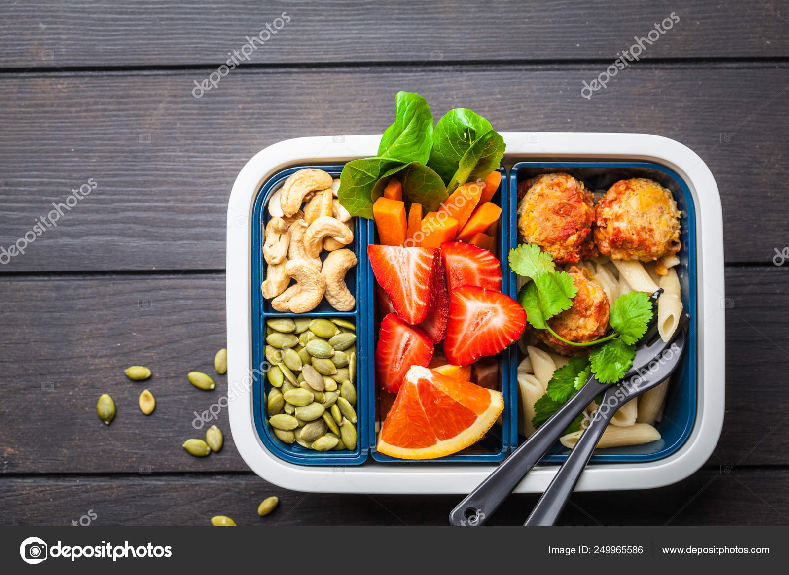 Healthy meal prep containers with beans meatballs, pasta, vegeta Stock