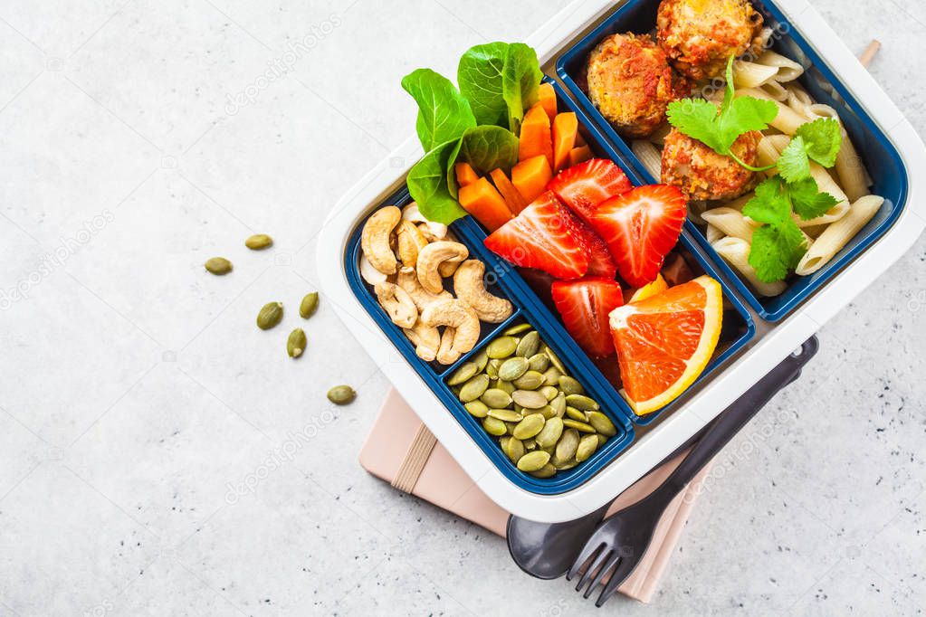 Healthy food lunch box. Vegan food: beans meatballs, pasta, vege