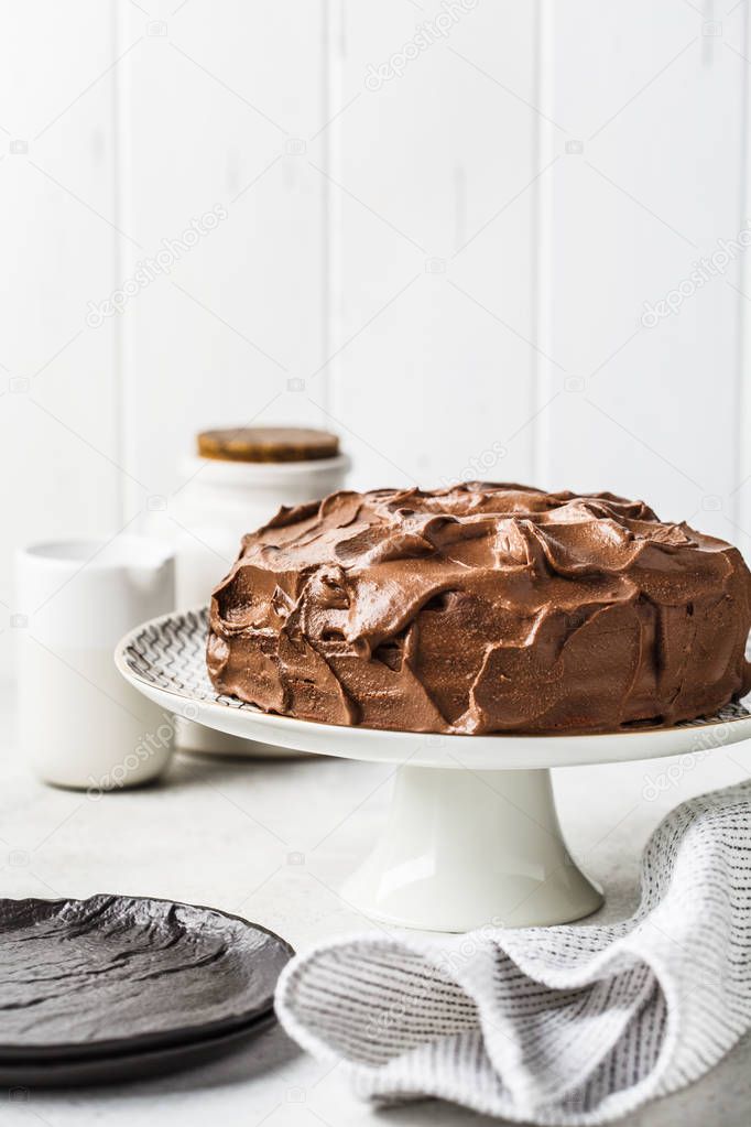 Homemade whole chocolate cake with chocolate cream and caramel
