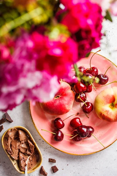 Beautiful pink food background. Flowers, chocolate dessert