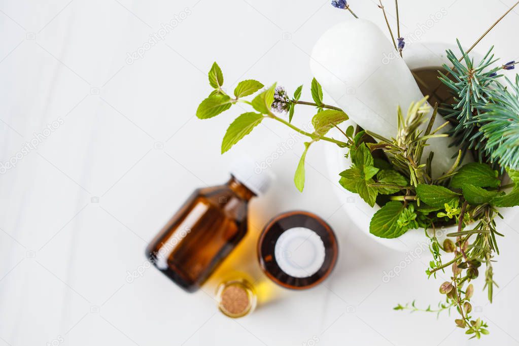 Bottles of essential oil, white background. Healthy cosmetics 