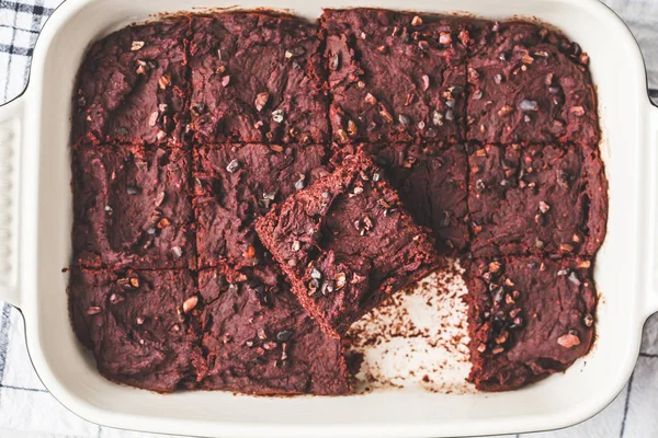 Beet vegan brownie in baking dish, top view.