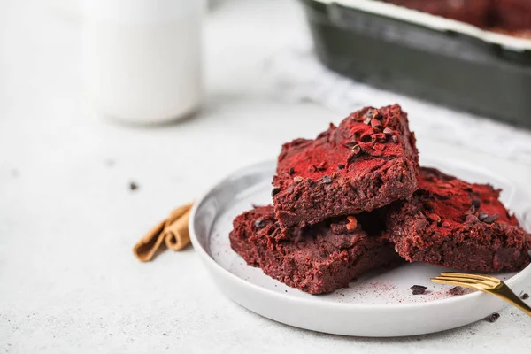 Beet brownie on gray plate, copy space. Healthy vegan food