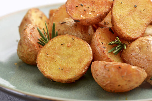delicious baked potatoes on a rustic green plate.
