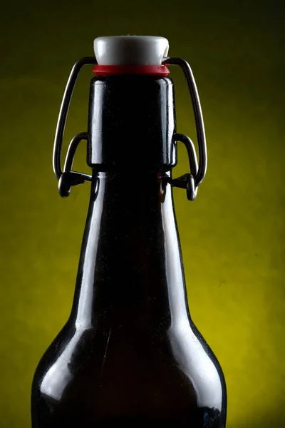 Beer bottle with lid dark glass on a dark background — Stock Photo, Image