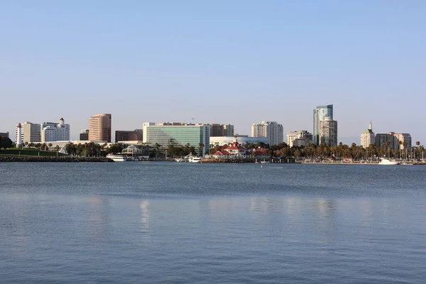 Downtown Long Beach, California, USA, July 15, 2025. The City Skyline Shows The Pike, Shoreline Village, Lighthouse, and Condo Buildings. The Pacific Ocean Reflects the Sunset on a Summer Day