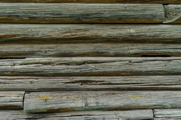 Horizontal old wood background from planed logs.