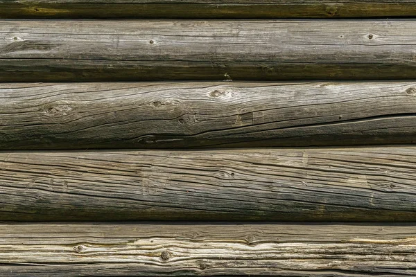 Horizontal old wood background from planed logs.