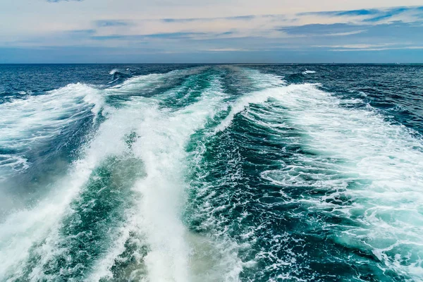 Sea water foam Ship track in the ocean Water texture. Ocean view Marine travel Cape cod Massachusetts US