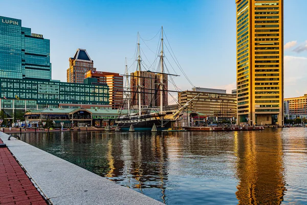 Baltimore, Maryland, US - September 4, 2019 View of Baltimore Harbor with USS Constellation Ship and office buildings