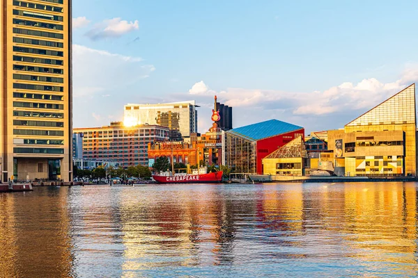 Baltimore, Maryland, US - September 4, 2019 View of Baltimore Harbor with USCG Lightship Chesapeake, Submarine USS Torsk and office buildings.