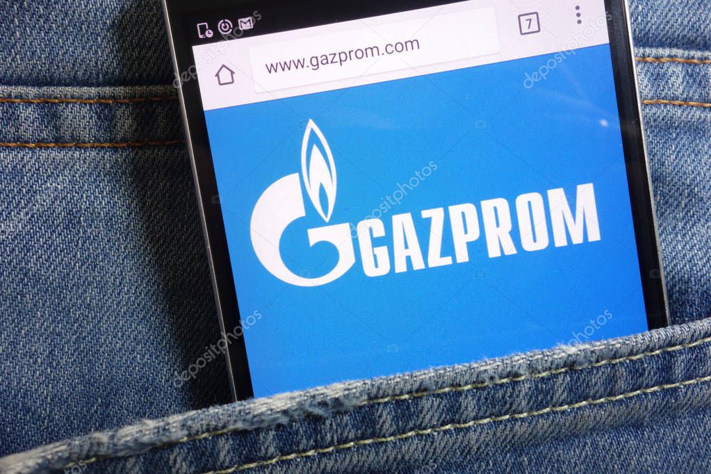 KONSKIE, POLAND - MAY 18, 2018: Gazprom website displayed on smartphone hidden in jeans pocket